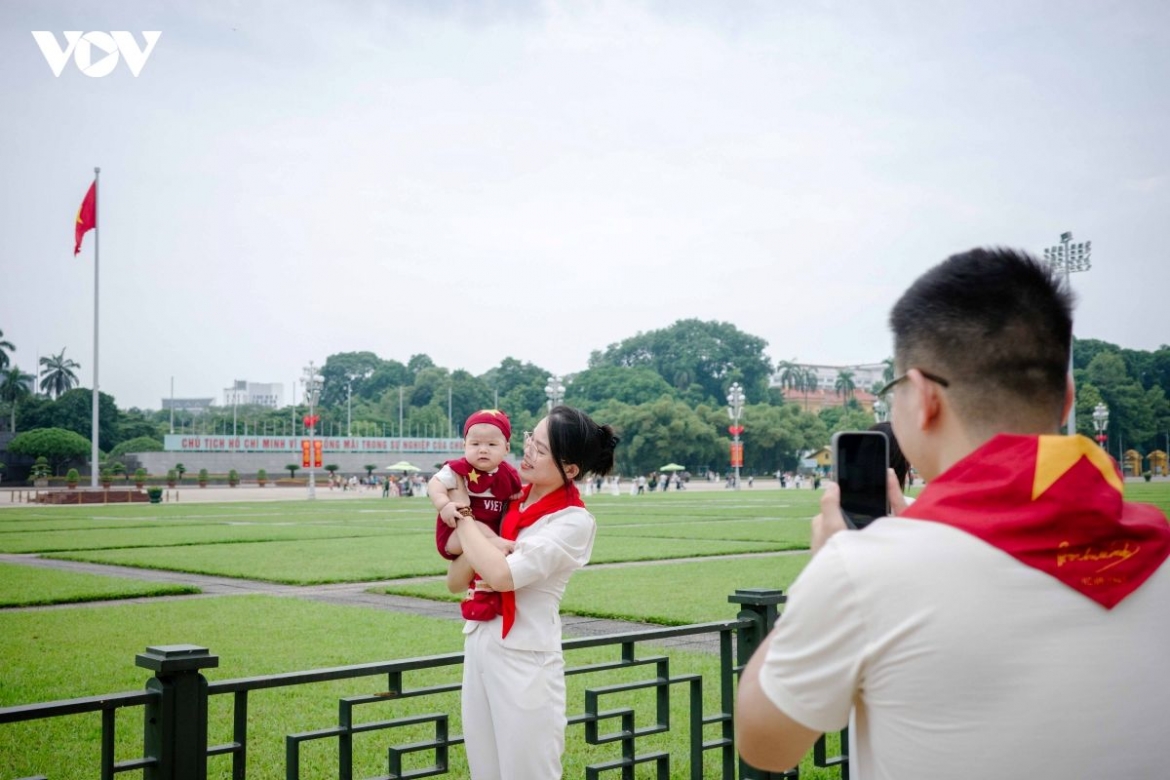 A family visits Ba Dinh Square together. For adults, the site may hold layers of memory; for children, it can be among their first encounters with stories of national history.
