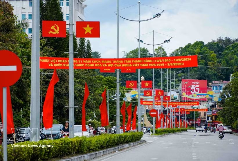 Party flags, national flags, and banners create a festive atmosphere along the streets of Dien Bien Phu ward, Hanoi