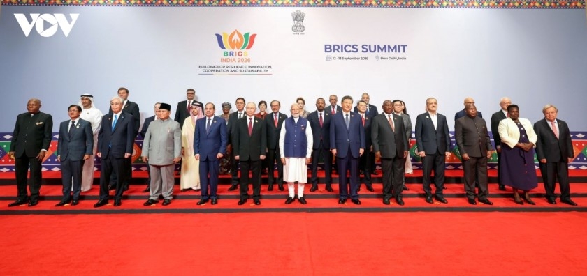 BRICS leaders, partner country representatives, and international organization heads in a group photo